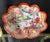 This scalloped Kutani porcelain bowl is decorated in the classic manner with a polychrome figural scene depicting court...