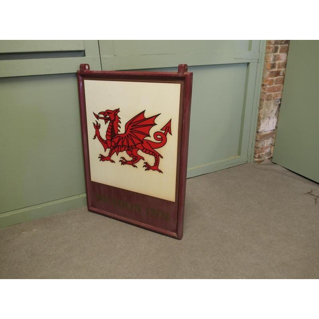 Wooden Framed Hanging Pub Sign. “Red Dragon” This is an original large and heavy piece dating from the beginning of the...