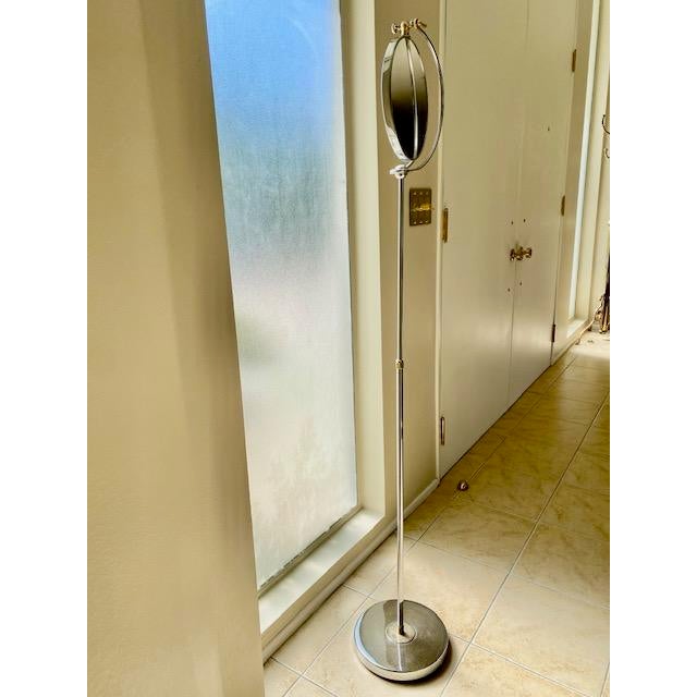 Vintage Italian Modern two-tone chrome and brass detailed standing mirror in a Mid-Century Regency style, reminiscent of...