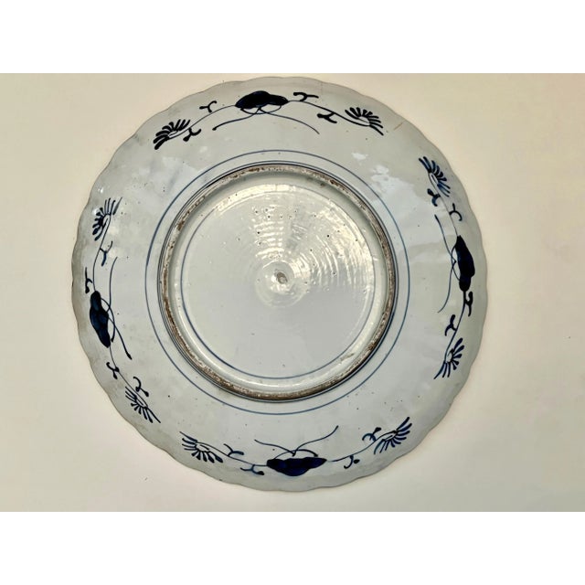 This is a good example of an Imari Charger that features a central basket, small scalloped border with an allover cherry...