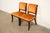 A gorgeous pair of Regency style side chairs or dining chairs By Kittinger USA, Circa 1960s Carved mahogany frames, with...