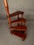 Distinctive English mahogany custom spiral library steps featuring four steps that wind upward around a central turned...
