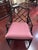 Elegant pair of Chippendale armchairs featuring a classic faux bamboo frame with an intricate lattice-back design. The...