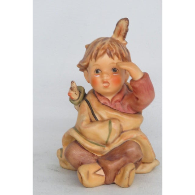 This darling figurine is made of ceramic. This charming figurine was made by M.I. Hummel by Goebel , and the bottom of the...