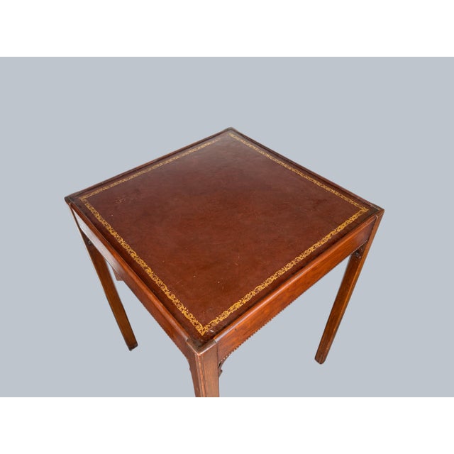 A pair of vintage Mahogany End Tables. Simple Chippendale style with leather top and gold tooling.