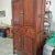 Exceptionally fine early 19th century Chinese elm armoire. Two upper doors open to an interior with single shelf and two...