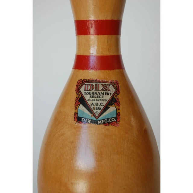 Mid-century wood bowling pin table lamp Dix Tournament Select mounted on round wood base. Measures 9" Diameter Base x 20"...