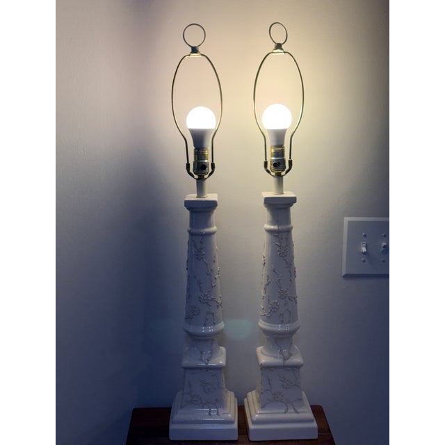 An impressinve and rare grand-scale pair of vintage Chinoiserie table lamps, stading at a commanding 34" tall. These Mid-...
