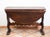 An antique table featuring an “Asso di Coppe” leg, made entirely of solid walnut with side wings, dating from the 17th...
