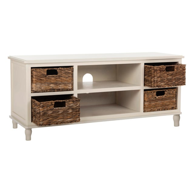 The ideal TV unit for coastal and country interiors, this pine piece in distressed white finish has natural rattan baskets...