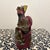 This evocative 19th-century hand-carved wooden sculpture depicts a seated Chinese deity, likely a home guardian or an...