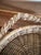 Charming vintage woven wicker and rattan basket crafted in a whimsical fish shape, with a beautifully woven circular body...