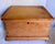 This charming antique pine storage trunk dates to the late 19th or early 20th century and features wonderfully simple...