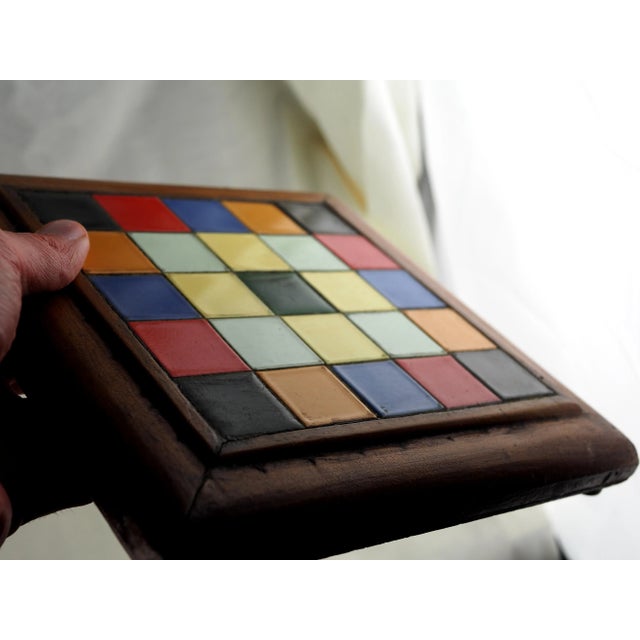 Multicolor tiled trivet. Metal pods. 50's typical, perfectly fit in vintage scenery but can be used in pop, kitsch, hippie...