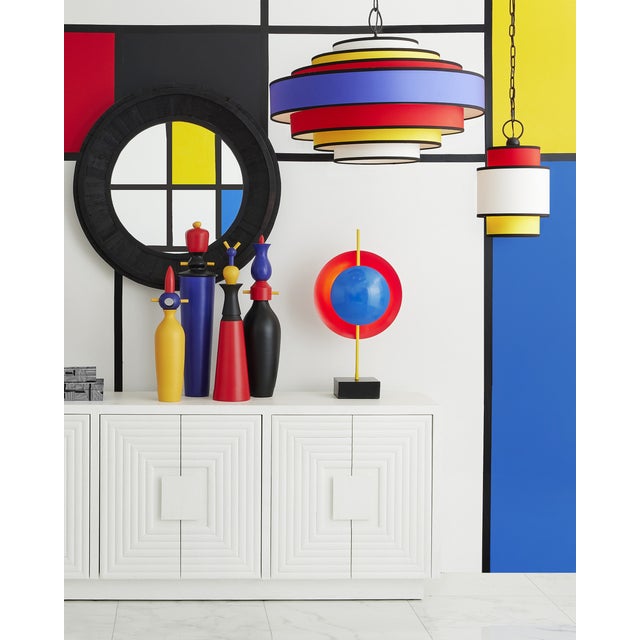 With its bright primary colors in red, yellow, blue, and white, the Maura Pendant is a nod to the continuing popularity of...