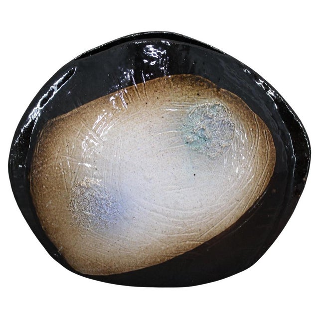 A sculptural ceramic art vase created in Czechoslovakia during the 1970s. This studio pottery piece showcases a bold...