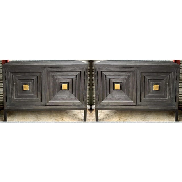 This is a pair of new organic modern cabinets by Uttermost. They have a distressed black finish and gilt metal accents ....