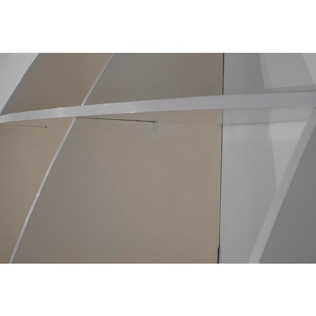 Large "Tyco" bookcase in lacquered plywood with a beautiful ivory patina. Composed of 7 horizontal and 7 vertical...