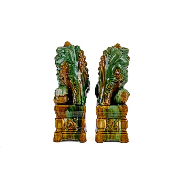 Rare Mid-Century Modern Chinese Ceremic Food Dogs in Vibrant Sancai-Style Green & Amber Drip Glaze. These specific figures...