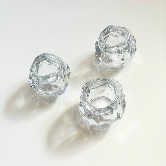 A set of 3 vintage glass votive candle holders in the shape of snowballs. Great realistic shapes, made of clear glass with...