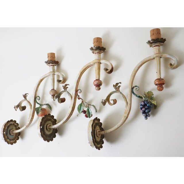 This set of three enormous, hand-forged wall lights is exceptional, embodying elegance and quality. Hand-forged by a...