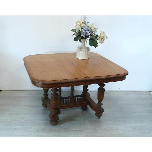 Antique extendable dining table, natural oak wood from around 1940, historicism, in a beautiful country house style. also...