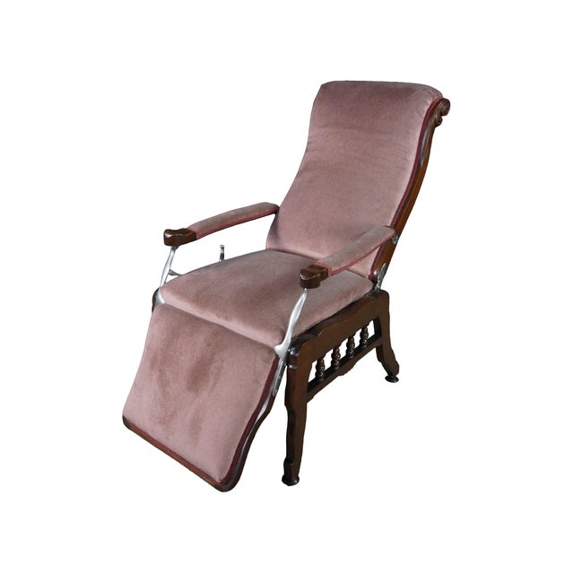 This exceptional late 19th-century Victorian mechanical reclining library chair stands as a magnificent example of high-...