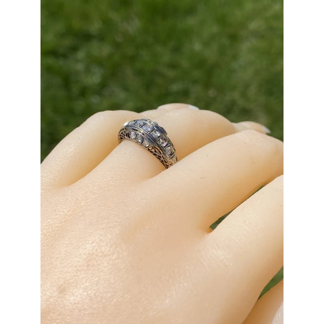 The Double Springs: Antique White Gold Art Deco Rose Cut Diamond Ring. The ring features a central old mine cut natural...