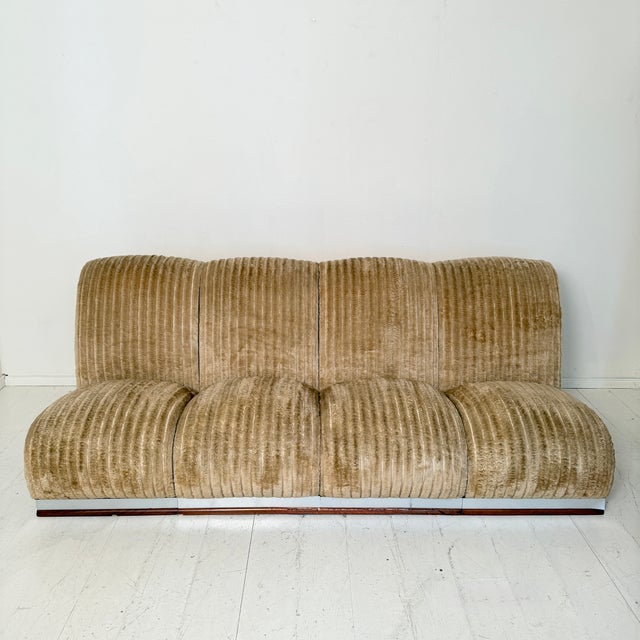 A stylish Mid-Century Italian modular sofa from around 1970, retaining its original beige cord fabric. The design reflects...