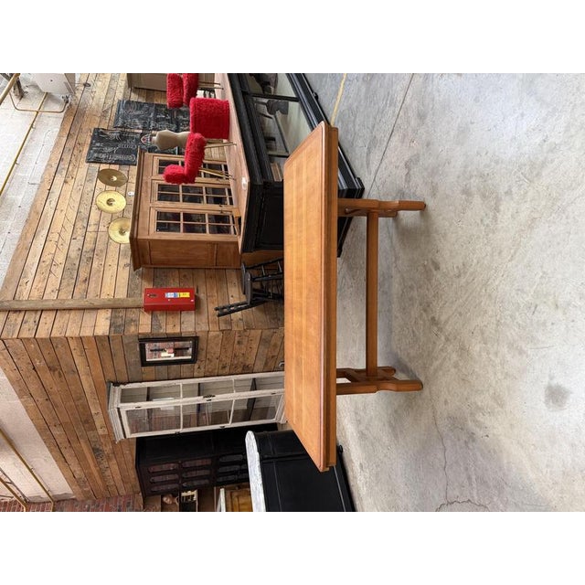This 1970s oak table is in very good overall condition. It was designed by Robert Guillerme and Jacques Chambron for the...