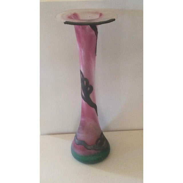 A blown glass sculpture vase in the shape of a trumpet, entirely handmade, entwined with metal composed of copper, nickel,...