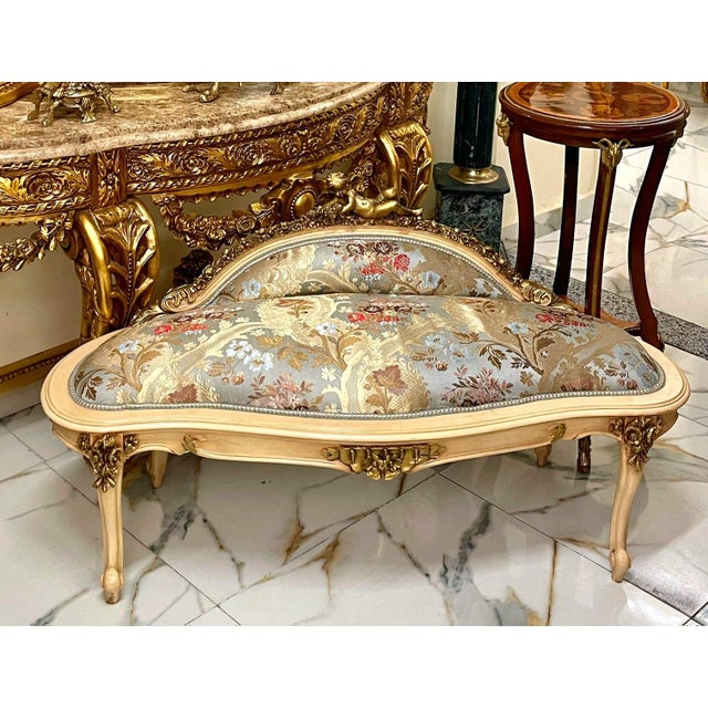 This exquisite antique French-style settee is a timeless statement piece, perfect for elegant interiors. Upholstered in...