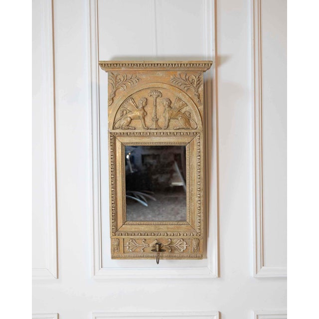 This exceptional early 19th-century Swedish Neoclassical mirror is hand-carved in wood and retains its beautifully aged...