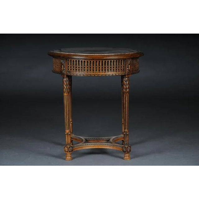 Classic French side table in Louis XVI, beechwood hand-carved solid beechwood. Round relieved frame base on fluted legs....