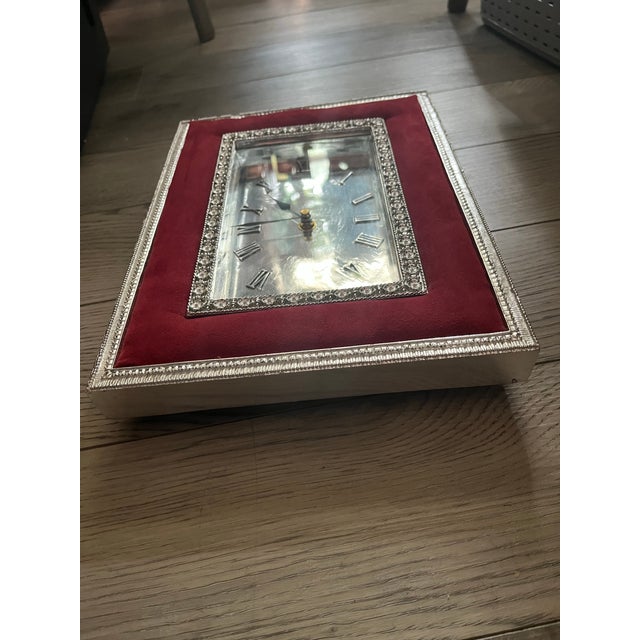 Vintage 1950’s Italian-Styled, Red Velvet trimmed, Silver Analog Shelf Clock that measures about 10 inches wide by about...