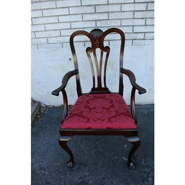 Great Queen Ann mahogany desk, side, accent armchair featuring an ornate carved slat back and an inset upholstered seat...