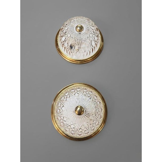 Illuminate your space with this charming mid-century modern flush mount light. Featuring a beautifully textured glass dome...