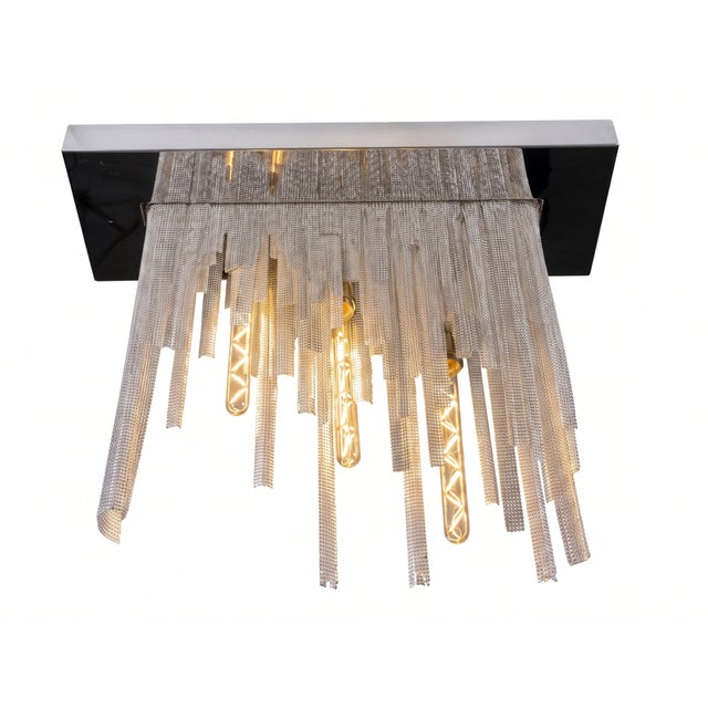 The Concept: Haute Couture meets Industrial Design Waterfall is a true "sartorial chandelier," born from the visceral...