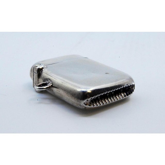 Silver Matchbox with Hanging Ring, in Very Good conditions. Designed 1890 to 1919 This piece has an attribution mark, I am...