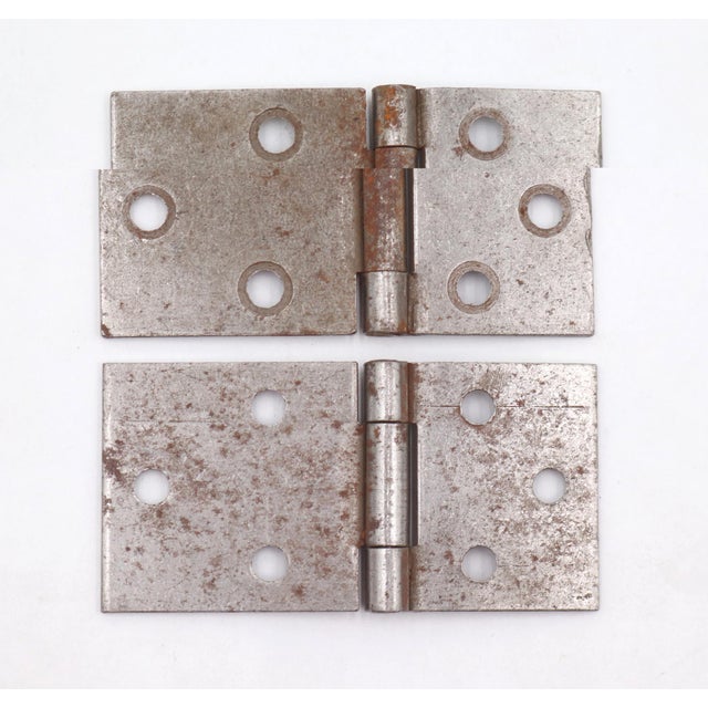 Vintage cabinet hinges made of bushed steel with flat tips, three knuckles, and a template hole pattern. The original...