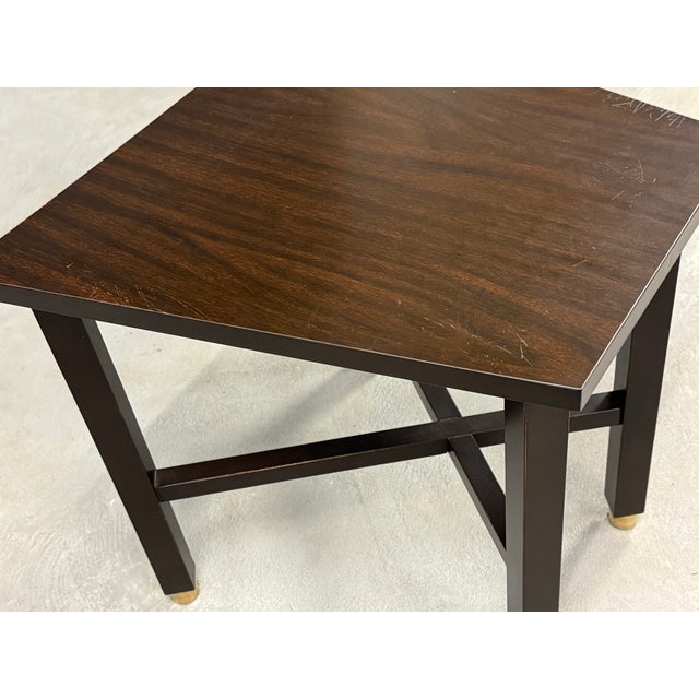 A mid century modern formica top end table designed by Edward Wormley for Dunbar. Front edge width measures 12”. 20” wide....