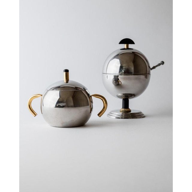This vintage sugar or marmalade serving set from the 1980s is a striking example of elegant postmodern tableware. Crafted...