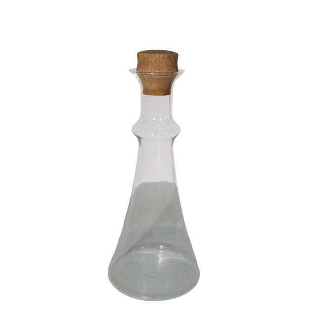 Classic Danish design wine carafe, decanter, designed by Gunnar Cyren for Dansk. The piece features a bottle form body,...