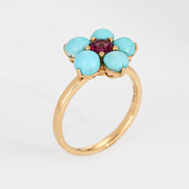 Stylish contemporary turquoise & pink tourmaline ring crafted in 18k yellow gold. Cabochon cut turquoise measures 5mm each...