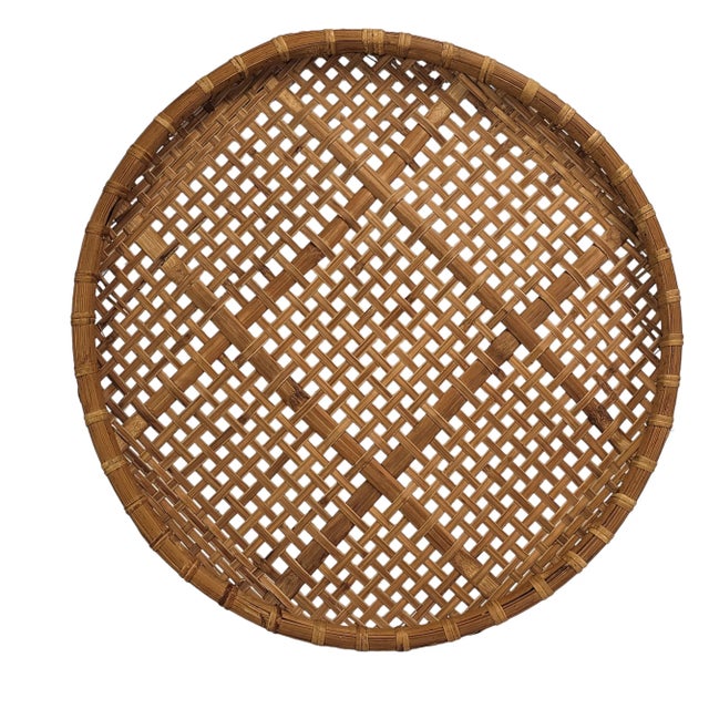 This vintage Asian boho rattan threshing basket, dating back to the 1970s, is a rustic beauty. Its round, brown design...