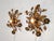 Stunning pair of vintage Florentine wall or ceiling lamps, handcrafted in gilded wrought iron with floral motifs. The...