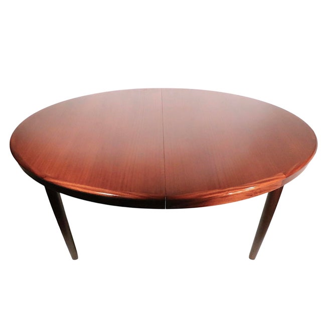 Exceptional Mid Century Danish Modern dining table, designed by HW Klein for Bramin Mobler. The table is constructed of...