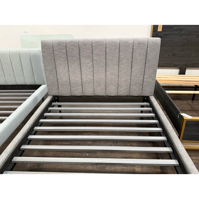 Design Plus Gallery presents a Queen Size Hartley Bed Frame from Room & Board. Upholstered in charcoal toned fabric, the...