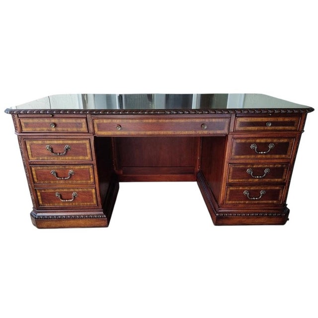 This exceptional two-piece executive home office suite by Legacy Classic Furniture features a grand double-pedestal desk...