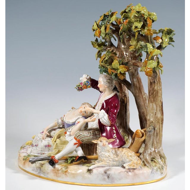 Excellent and rare meissen porcelain genre group: elegantly dressed rococo couple in the shade of a group of trees: a...